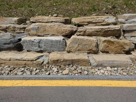 Stone foundation on the side of the road Stock Photos