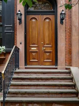 Stone front step of elegant old urban brownstone type townhouse Stock Photos
