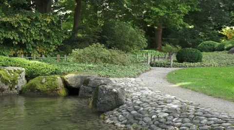 Stone garden with a pond and path Stock Footage 43805076