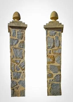Stone gate posts with natural stone trim stand proudly in isolation under c.. Stock Photos
