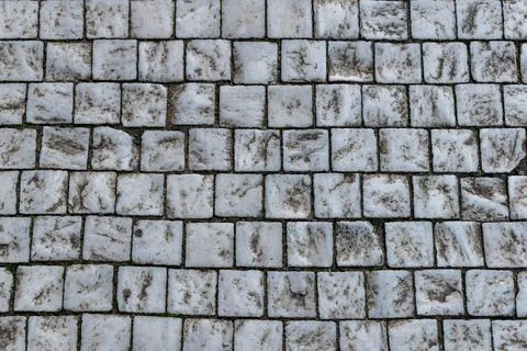 Stone granite cube surface, retro pattern on pavement Stock Photos