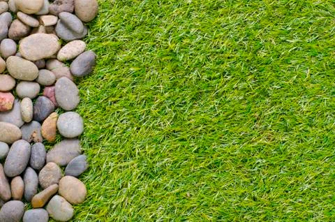 Stone on grass background Stock Photos