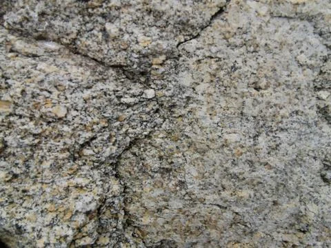 Stone gray background, texture of stone wall with cracks Stock Photos