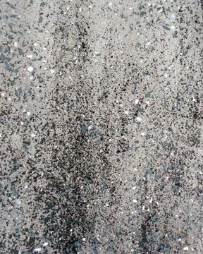 Stone grey texture with multicolored impregnations background Stock Photos