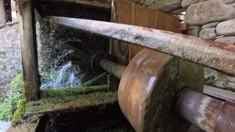 Stone grindstone water powered ancient construction Stock Footage 313013583