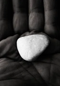 Stone at hand, concept Stock Photos