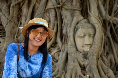 Stone head of buddha in root tree of Wat Mahathat Stock Photos