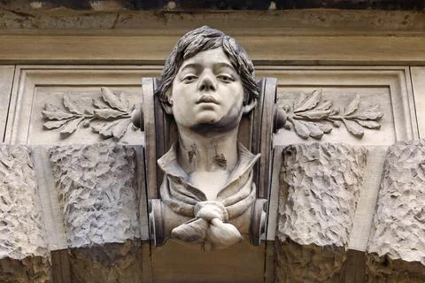 Stone head of a house facade Stock Photos