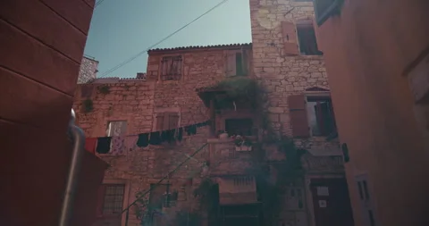Stone houses with laundry hanging between buildings Video stock 334103584