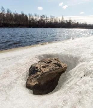 Stone in Ice by River Stock Photos