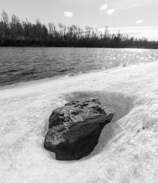 Stone in Ice by River Stock Photos