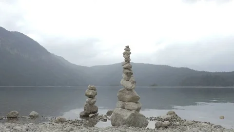 Stone installation with the lake on the background Stock Footage 77450051