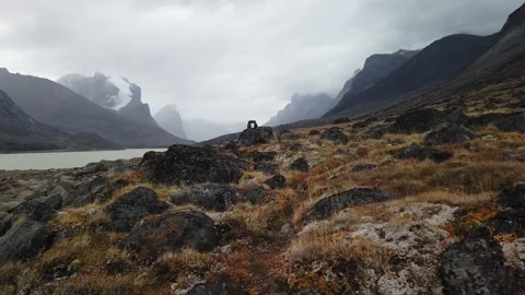 Stone inukshuk in the remote arctic wilderness of Baffin Island, Nunavut, Canada Stock Footage 238838971