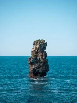 Stone island in the sea Stock Photos