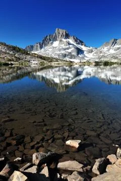 Stone in lake with mountain Stock Photos