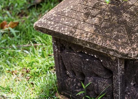 Stone lantern ornate pattern with an elephant figure with patina old building Stock Photos