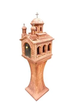 Stone lantern in the shape of a monastery as garden decoration on a white 스톡 사진