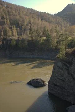 Stone ledge in the middle of a mountain river at a cliff. Altai, Siberia, Rus Stock Photos