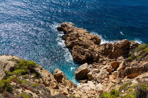 Stone ledge in the sea Stock Photos