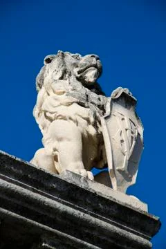 Stone lion with shield Stock Photos
