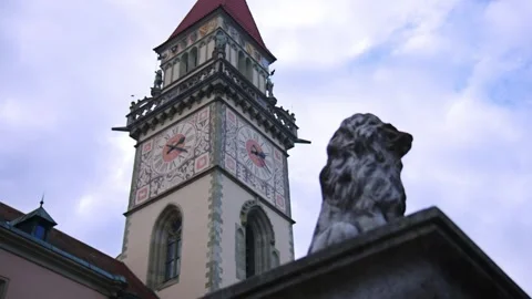 Stone Lion Statue with Historic Clock Tower in European City Stock Footage 301581968