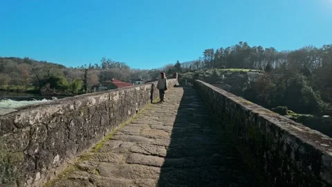 Stone Maceira bridge on the Camino de Santiago in Galicia Видео 325986920
