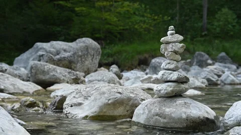 Stone man on a mountain stream river bed in the evening Stock-Footage 260834393