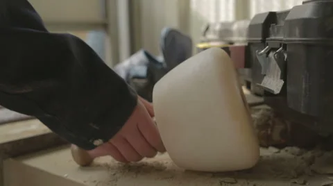 A stone mason picking up a mallet ready to work Video stock 58639931