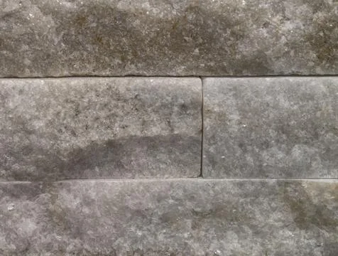 Stone masonry with rough texture suitable for fireplace surrounds and building Stock Photos