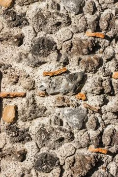 Stone masonry wall texture close up with black lava stone Stock Photos