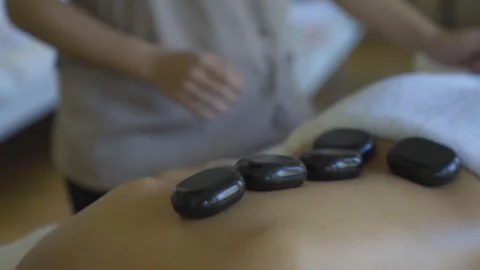 Stone massage in the spa Stock Footage 260221104