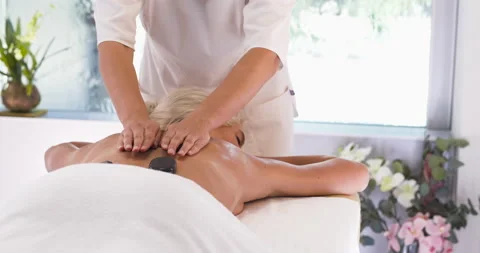 Stone massage in spa salon, back massage Video stock 211819668
