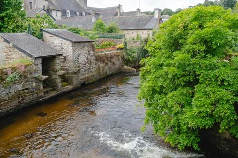 A stone mill flows next to a rushing river. Pont-Aven, 09 June 2026 Stock Photos