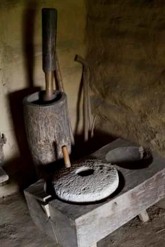Stone millstone, manual processing of grain Stock Photos