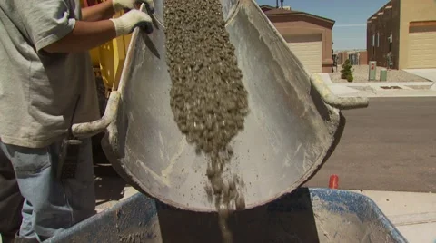 Stone mixture being poured in cement trolley Stock Footage 55570062
