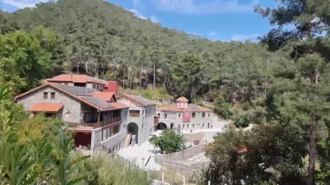 Stone monastery amid pine forest in Cyprus mountains Stock Footage 328097542