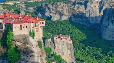 Stone monastery in the mountains. Kalabaka, Greece summer cloudy day in Meteora Stock Photos