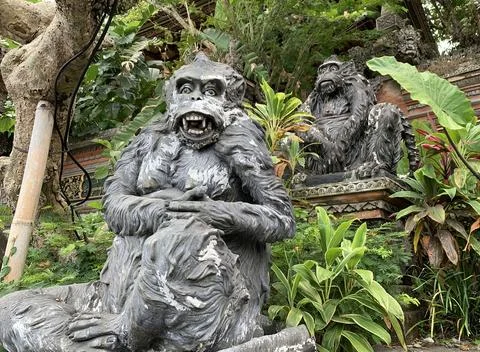 Stone monkeys statues in sacred monkey forest. Old decorative monkey sculpt.. Stock Photos