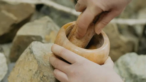 Stone mortar and pestle close-up. Media. Traditional oriental cuisine or Vidéo 230409166