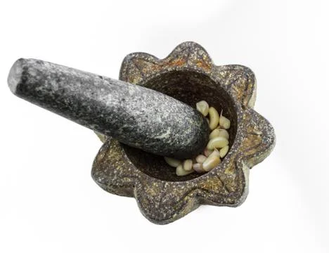 Stone mortar with garlic isolate Stock Photos