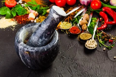 Stone mortar with pepper on a table. Stock Photos