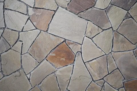 Stone mosaic wall background texture . Vintage wall backdrop Stock Photos