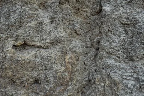 Stone mountain texture. A close up view of a steep stone quarry face showin.. Stock Photos
