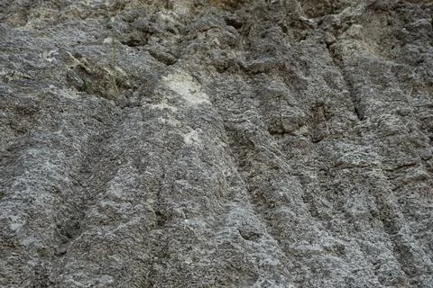 Stone mountain texture. A close up view of a steep stone quarry face showin.. Stock Photos
