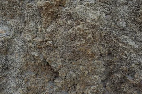 Stone mountain texture. A close up view of a steep stone quarry face showin.. Stock Photos