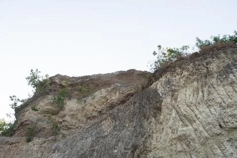Stone mountain texture. A close up view of a steep stone quarry face showin.. Stock Photos