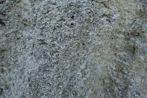 Stone mountain texture. A close up view of a steep stone quarry face showin.. Stock Photos