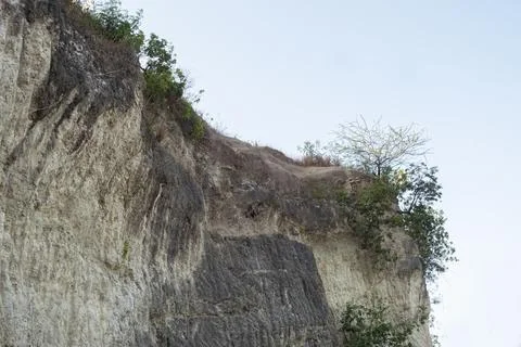 Stone mountain texture. A close up view of a steep stone quarry face showin.. Stock Photos