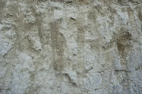 Stone mountain texture. A close up view of a steep stone quarry face showin.. Stock Photos