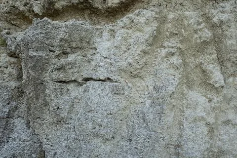 Stone mountain texture. A close up view of a steep stone quarry face showin.. Stock Photos